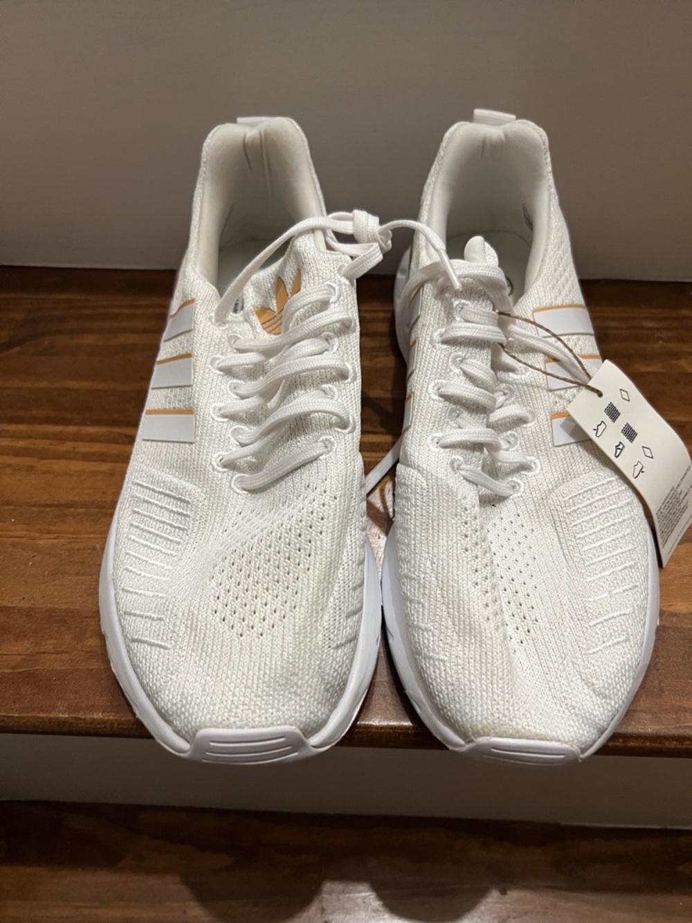 adidas swift run White and Gold Women's Athletic Shoes